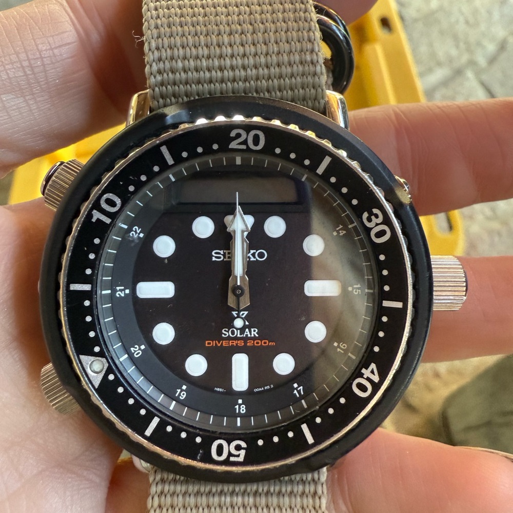 Seiko Prospex Arnie SNJ025 Watch - Black dial with tan nylon band.